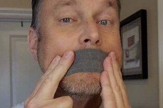 Man applying the Mouth Tape on his lips